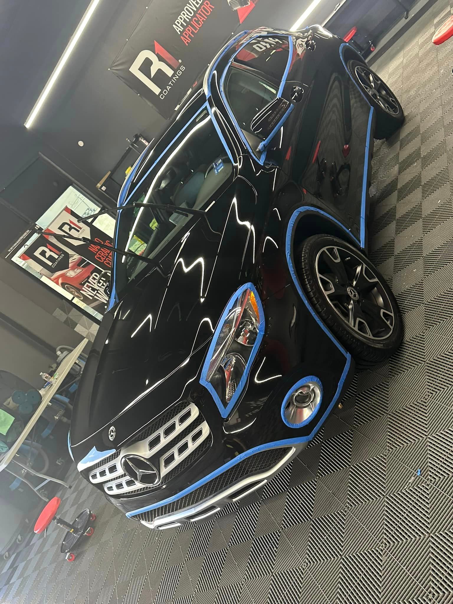 Auto Detailing - Black Mercedes-Benz prep masking at R1 booth - Professional Detailing Wisconsin Dells